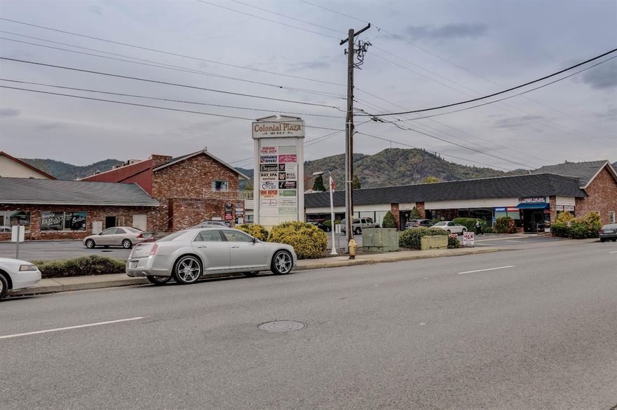 Excellent investment opportunity with this large-scale location in a high exposure area of Grants Pass. The Colonial Plaza currently has 28 units of mixed use retail / office space and great traffic on both E & F street. This property consists of just under 30,000 sqft and sits on 1.59 acres. It fronts 2 main streets with tons of off street parking. Solid rental history with great cash flow. Current income / expense report on file. Owner is willing to carry the loan with a minimum of 20% down! Great opportunity for investors.