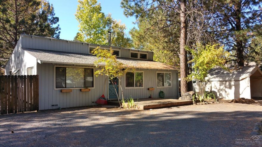 Cottage in Sisters 2 bedroom plus little loft in guest bedroom. 1.5 bath, vaulted ceiling in living room, cozy up to the wood stove, plus electric forced air heat. Half bath in Master bedroom, utility room for laundry service, fenced back yard, on .25 acre in downtown Sisters.