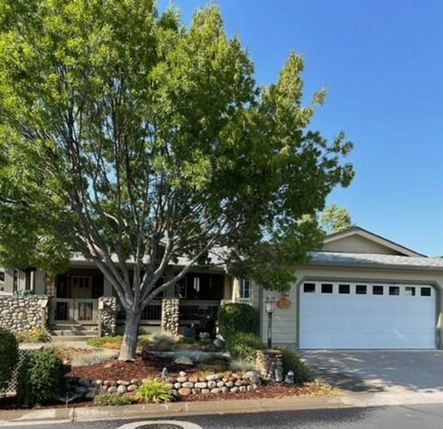 Absolutely the finest home in this 55+ park (Miller Estates). Nothing was spared.  Documented upgrades of $200,000+after the home was delivered.  Large walk-in closets.  All bedrooms have private entrances/exits to the outside.  Vaulted ceilings, elegant ceiling fans, glass transoms above the doors, leaded glass, solar tube, covered porch, electric shades on outside, water feature, solar hot water heater, all new high-end vinyl flooring and roof in 2021.  New paint 2020.  Granite counter tops, island, 5 burners down draft with commercial hood, microwave/convection oven, customized cabinetry throughout, pullouts in all cabinets, work bench and GDO internal built-in vacuum system.  Exposed aggregate handicap wheelchair ramp.  Custom cabinets in garage.  Hardy plank siding and vinyl fencing.  Private Park with creek-side seating and picnic tables and more!  A must see. Home is Broker owned.