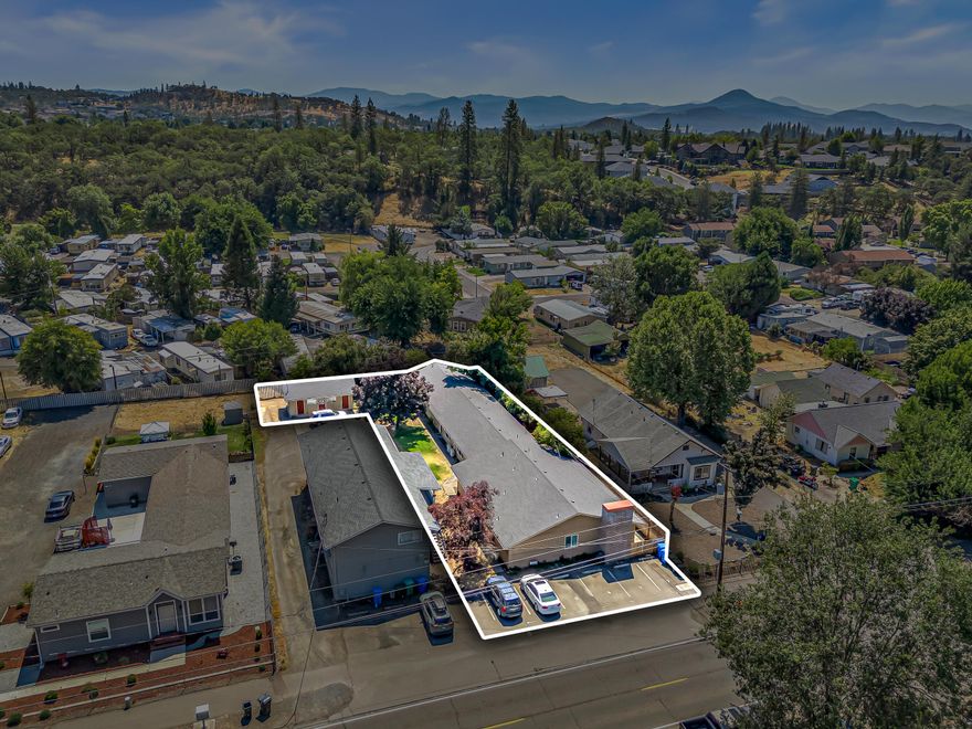 Turn-key 4-plex close to downtown Eagle Point! 3 of the units are 875 sq ft, 2 bd, 1 baths & the largest unit is a 1645 sq ft, 4 bed, 2 bath (All units are occupied & rents are $1150, $1235, $1200, & $1760 per month). All units have individual fenced yards. Total sq ft b/t all 4 units is 4271 sq ft & there's an additional 600 sq ft building (power, water, & sewer are available) that has 4 individual storage units (one for each tenant) that aren't included in the square footage & could possibly be converted into laundry space or home office. 3 out of the 4 units have been remodeled throughout (owner spared no expense & installed long lasting amenities) as well as replacing the roof & painting the entire exterior in 2019. 7 off street parking spaces provides ample parking for the tenants. The largest unit has forced air gas heat w/ central AC & the 2 bd/1 ba units have ductless mini split systems for heating & cooling!