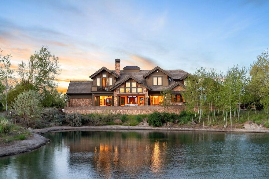 Welcome to Paradise at the coveted Juniper Preserve! This spacious, 4296sf home includes 4 bedroom suites (2 up, 2 down) with 2 additional 1/2 baths. Luxury kitchen with Tiger Maple cabinets, walk-in pantry and Wolf appliances. Enjoy stunning floor to ceiling views of the water and Cascade Mountains from the Great Room with stackable patio doors opening to your backyard oasis. Dining area also opens to the expansive back patio where you'll find the covered full outdoor kitchen - built in BBQ, wine fridge and mini fridge/freezer, dishwasher, side sun shades, hidden pop up TV and sunken fire pit, all overlooking the water and beyond! Another patio entrance adjacent to the hot tub leads to the large primary bedroom and sitting area, bathroom with rain head shower and ample closet. Upstairs suites boast incredible mountain views - one with private balcony! A large bonus room completes the upstairs retreat - don't miss the huge storage space or potential bunk room above the garage!