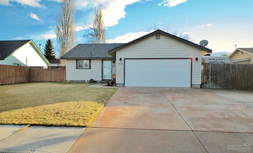 Don't miss this charming home with an open, vaulted floor plan. Updated lvp flooring and trim. Newer exterior and interior paint. Updated kitchen appliances. Added ductless heating/cooling unit makes this home comfortable and energy efficient. Front yard with underground sprinklers and a fully fenced backyard and covered patio. The stamped concrete walkway makes this home inviting with an extra side yard area for chicken or other pets. Don't miss the Gated RV parking! This home won't last long! Centrally located walking distance to several schools. Priced to sell!