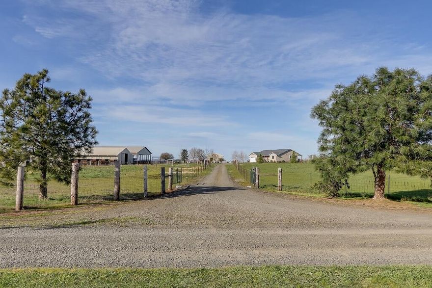 THAT HORSE PROPERTY YOU'VE BEEN WAITING FOR! Beautifully located 17.5 use-able acres w/ 80x168 covered arena, 140x250 outdoor arena, 10 stall barn, turnouts, hay pasture, covered trailer parking, 30x70 shop w/concrete floor, hot tub, above ground pool complete w/ palm trees & a beach! Dog runs. Garden area, great well flow, & RV dump. NICE home built in 2011 w/3 bedrooms, 2 baths, AND 2 offices. Great room floor plan, vaulted ceilings & incredible sunrise & sunset views. Internet by XS Media.