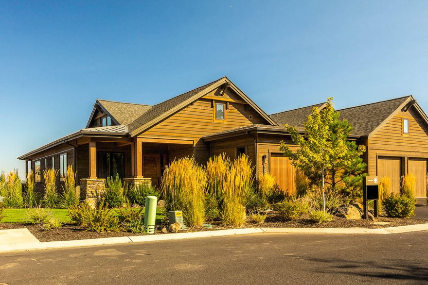 Cascade Mountain range views  from almost every window in this amazing Townhome in Tripleknot.  This floor plan boasts 4,141 sq ft with numerous custom features.  Gourmet kitchen, spacious great room, luxurious master suite and office / den on the main level.  Downstairs you have an additional 3 bedroom, 3.5 baths and a bonus room.  The home is upgraded throughout with unique designer finishes.