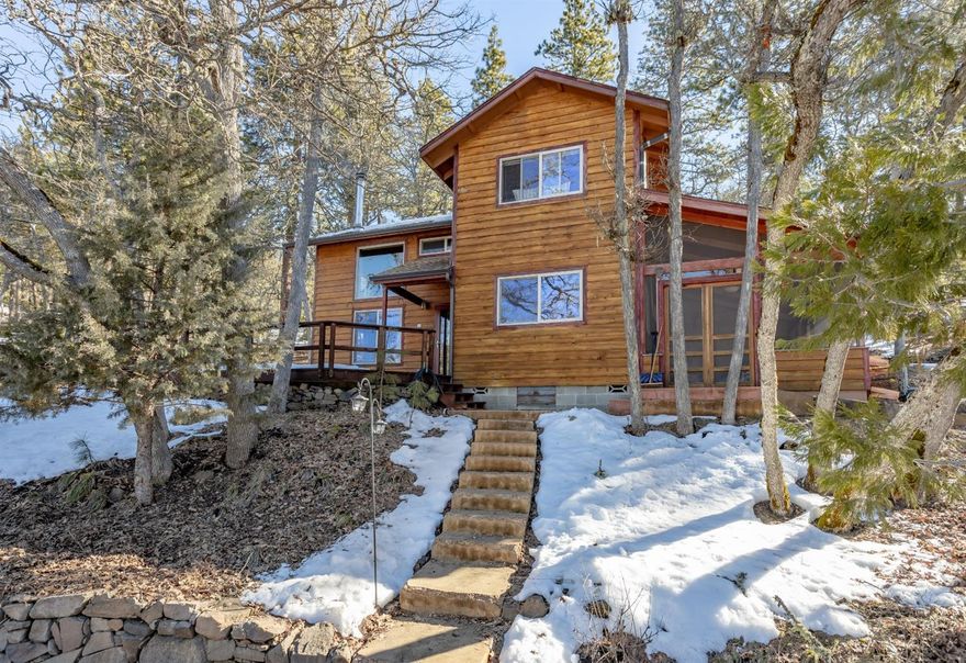 This property is nothing short of magical. Thoughtfully designed and lovingly cared for the character throughout this home will please the most discriminating buyer. There is a well designed, open floor plan with lots of windows and incredible natural light throughout. On the main level there is a full bedroom and full bath plus a screened in porch perfect for morning coffee. Upstairs you will find two additional bedroom and a full bathroom. The well-appointed kitchen features granite countertops and stainless appliances, stylish shelving and plenty of room for entertaining. The creative use of stone and wood throughout adds warmth and charm to this unique mountain home.