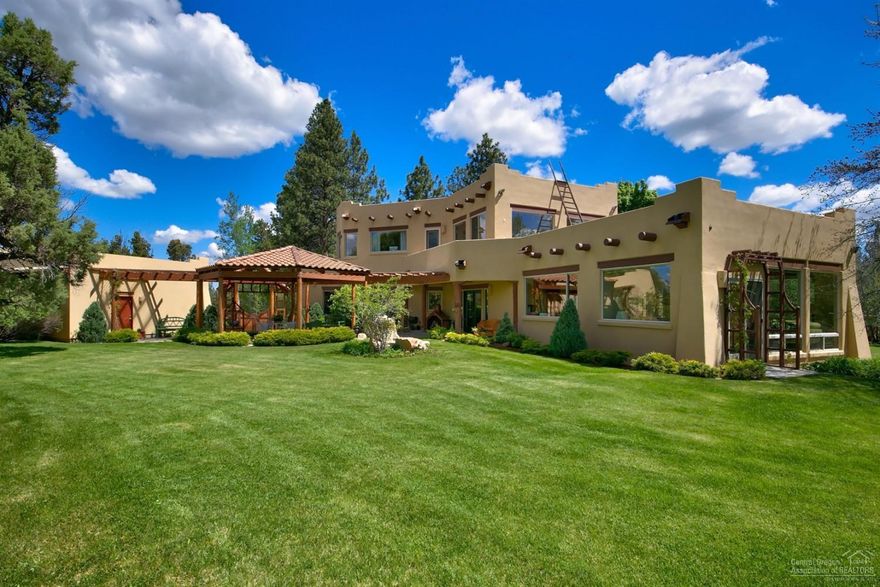 Beautiful Custom Home in Tumalo bordering public land & across the street from 250 acre park. Pueblo style home features: 3365 sf, 3 bed, 3 bath, living room, dining area, den, sunroom, solarium, radiant floor heating, stone & oak flooring, patios, 2 double car garages and Peek-a-boo Cascade Mtn views. Property is 21 acres with pine trees, 2 ponds, meandering irrigation canal, landscaped with sprinkler system, paved driveway, barn & walking trails. Wildlife tax deferral. Secluded Setting for any lifestyle!