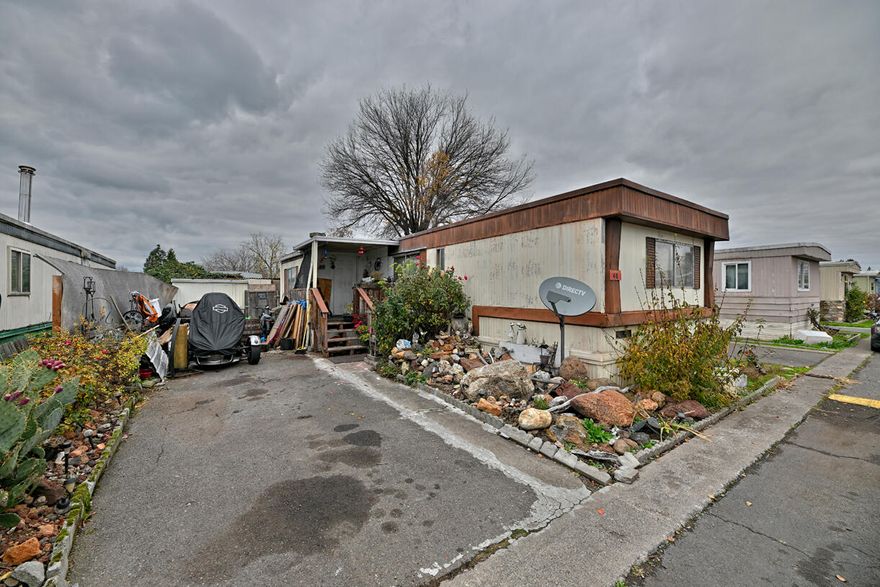 Discover an affordable opportunity in this pet-friendly, family-oriented park in White City, OR! This single-wide home has solid layout and is brimming with potential for investors, flippers, or first-time buyers looking to build equity through sweat equity. Whether you're planning a renovation project or searching for a budget-friendly way to enter the housing market, this home offers a rare chance to customize a space to your taste at a great price point. Located in the heart of White City, you'll enjoy easy access to local parks, schools, shopping, and outdoor recreation. The area is known for its friendly community atmosphere, proximity to the Rogue River, and quick commutes to Medford and Eagle Point—ideal for anyone who values both convenience and a relaxed lifestyle. Bring your vision and make this place shine! Opportunities like this don't come along often.