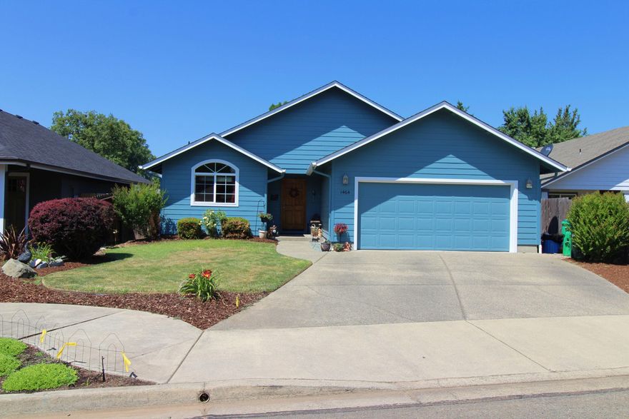 Pride of ownership shines thru-out this well maintained 3 bedroom, 2 bath 1525 SqFt home.
The home offers an open floor plan, cozy gas fire place, walk-in master bedroom closet, jetted tub in the master bathroom, newer interior & exterior paint, sky lights in the living room that let in lots of natural light, bar counter in the kitchen for bar stools, hickory cabinets and doors, attic storage, wired with speakers & upgraded lighting dimmers thru-out the home, and built in heaters in the garage.  Outside the property offers a lovely landscaped front & large back yard, with a water feature, covered back patio with a retractable awning for additional shade, the patio area is plumbed with natural gas for BBQ hook up, large shade tree and inground sprinkler system.