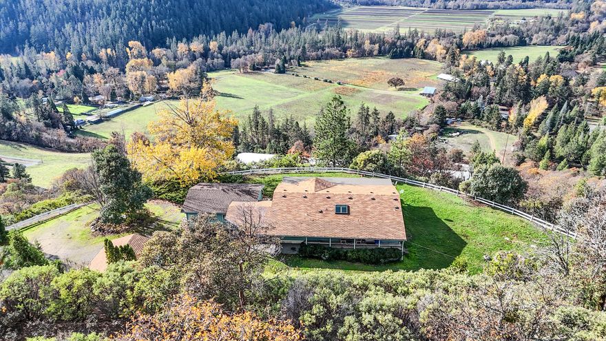Discover an exceptional 204-acre estate offering true ''top of the world'' views where you can see forever. Perfectly positioned close to Ruch, Jacksonville, and the Applegate Valley, this property sits in the heart of wine country, surrounded by rolling hills, vineyards, and endless natural beauty. The very livable 1,188 sq ft home features 3 beds/2 baths, providing a comfortable base for full-time living, weekend escapes, or future expansion. Miles of private ATV and horseback trails wind through the property, creating opportunities for recreation, exploration, and adventure. Bordering thousands of acres of BLM land, this rare offering delivers unbeatable access for outdoor enthusiasts—whether you enjoy hiking, riding, or simply soaking in the incredible scenery. For hunters, the landscape and access make it a true paradise with abundant game and excellent terrain. With unmatched privacy, incredible views, and limitless potential, this property is a legacy-caliber So. Oregon retreat!