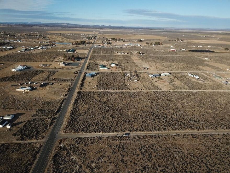 Buildable land for sale in Christmas Valley, Oregon - 1 acre with open views, near pavement, power, and fiber internet, plus close to town. This rectangular lot offers flat, usable ground and plenty of room for future building plans. Located just off Old Lake Rd, you'll have easy year-round access and quick travel into town for groceries, gas, and local services. The property provides flexible options, with power nearby and space suitable for a home, manufactured home, cabin, tiny house, shop, or potential RV use (buyer to verify with Lake County). Enjoy big skies, long views, and the quiet high-desert setting Christmas Valley is known for. Outdoor recreation is close by, including the Lost Forest, the Christmas Valley Sand Dunes, Crack-in-the-Ground, and Fort Rock State Park - offering hiking, riding, exploring, and exceptional stargazing throughout the year. A solid opportunity for buyers seeking affordable acreage, buildable land, or a future recreational base in Central Oregon!