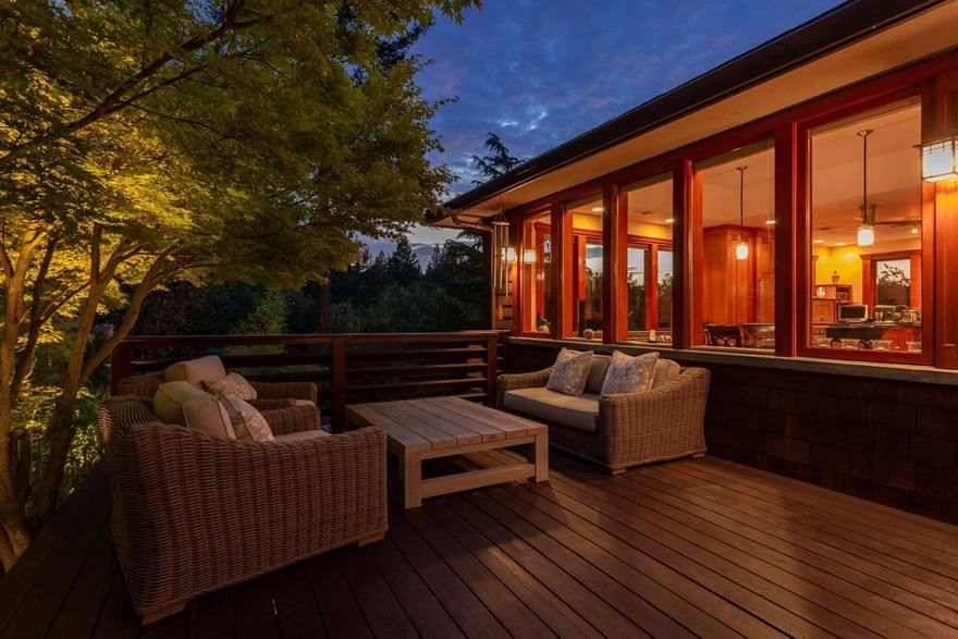 Tucked away on a private drive with breathtaking views and sited in a spectacular, unique setting in the mountains and majestic ponderosa pine forest, this contemporary Craftsman-style custom home is a stunning one-of-a kind work of art. You'll be captivated by the creative use of indoor-outdoor space, Japanese-style gardens, quality woodwork, clean lines, and understated artistic accents which blend in perfect harmony to create this serene, beautiful, and unique home. Detailed custom woodwork throughout was crafted with both native and exotic woods. Walls of windows, soaring ceilings, and rich organic colors lend a quiet elegance to the open floor plan. The expansive gourmet kitchen is a showcase of modern and functional style with mahogany cabinets, quartz counters, and two-sided stone fireplace. Luxurious, private master wing with walls of east facing windows. A remarkable blend of functionality, style, and creativity make this home a showcase of architectural artistry in Ashland.