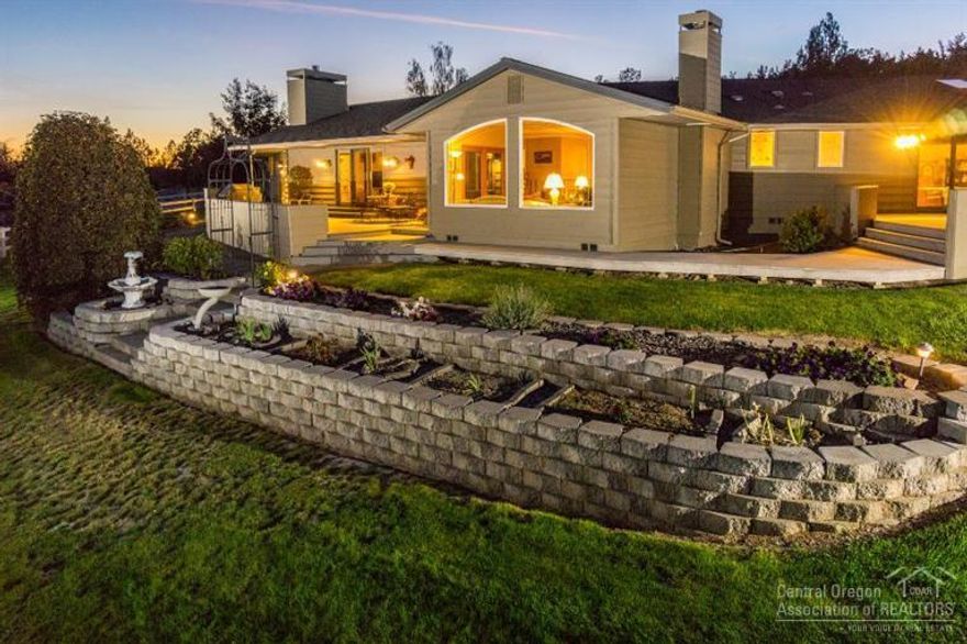 Designed with distinction, you'll be proud to own this home on 1.26 ac w/lg shop, storage bldg. & ample space for RVs. Landscaped to perfection w/extensive tiered stone work that lights up the vibrant floral colored beds, paved driveway. Rich warmth is displayed throughout this 2837sf, 3bd, 3.5 custom home + office/den. Home features formal dining room, kitchen nook, eating bar, lg pantry, Living room & FR, gas fireplace, hardwood flooring & crown moldings. Enjoy the city views from the large trex deck.