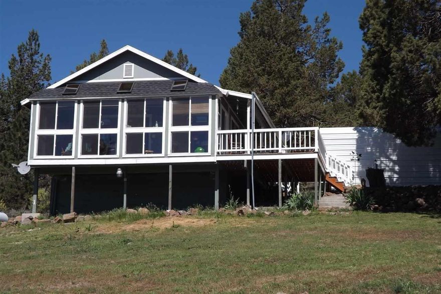 Beautiful View! This Well Kept Home Features Hardwood Floors Throughout, All Appliances Less Than 1 Yr. Old Including Washer & Dryer, Granite Counter Tops, Beautiful Enclosed Sun Room, Large Deck Perfect For Entertaining And Just Enjoying The Peaceful Surroundings With A Beautiful View! Not Included In The Sq Ft Is An Additional 600 Sq Ft Guest House! All The Work Has Been Done! This Property Is A Must See!The Septic Has Been Replaced Within The Last Year; Central Heating & Air Was Installed 1 1/2 Yrs. Ago; The Well Pump And Piping Was Replaced Just Over 2 Yrs. Ago Along With A New Filtration System Also....The Guest House Comes Fully Furnished! Includes: Pool Table, Murphy Bed, Couch, Bar Stools! This 40 X 60 Shop Includes A Plumbed Commercial Compressor!