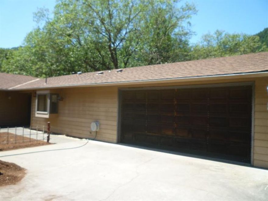 Price for quick sale! Over 1,700 sq. ft. 3 bedroom 2 bath home on a little over 2 acres ready for your personal touches to make it your own! Needs a little TLC but you won't find this value very often. Home was built with full ADA requirements in mind. Sinks, oven, wheelchair access shower, wider hallways and doorways. Could be a great 2 family set up for hardship dwelling ( used to have one) located on the clearing below.