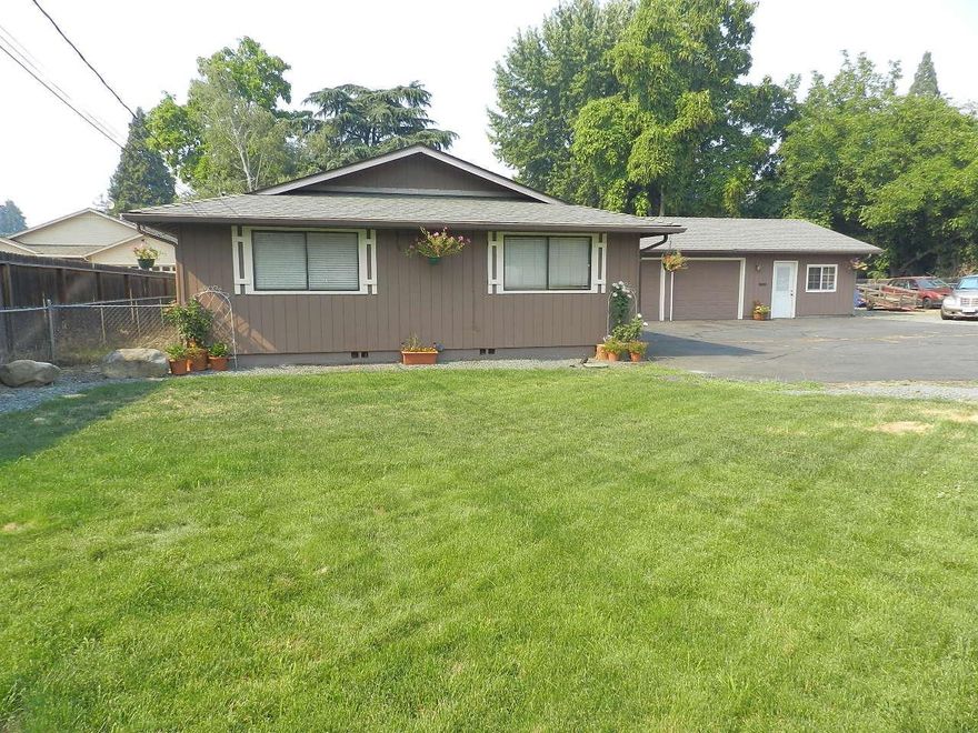 Nice sized inviting home in Central Point on .27 acre lot, close to Hanley so quick to Jacksonville or downtown Central Point. There are 3 large bedrooms, 2 good sized bathrooms, a great room style living room with softly vaulted ceilings and wood beams, all open to the kitchen and wonderful peninsula for entertaining. Oversized garage has a Bonus area that has multi purpose, shop, 4th bedroom, office etc. Huge amount of parking for vehicles & RV. New roof 2013. New plumbing inside home and to the front meter. Front sprinklers. Access weatherization was done and they added insulation in attic and seals to garage and front door. New carpet. New paint various places inside and out. The furnace had some electronic and blower/ controller replaced