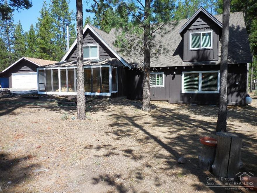 Mountain lodge/chalet style home on over 1 acre among pines at the end of a quiet country lane in Fall River.Sunken living room with Jotal wood stove on a Montana slate hearth.The addition of 1200 sqft in 2006 has quality knotty alder cabinets,granite counter tops, island/breakfast bar,stainless appliances.Gas fireplace in eat-in kitchen.Master bath has walk-in shower,soaking tub.Huge decking,big sun room,large family/game room wired for sound.Cute small barn for hobbies/crafts. Get ready for great fishing.