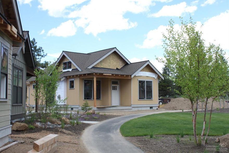 Easy living inside and out. This cabin-like, single family home is crafted with a personal touch by Tyee Development. Includes upscale kitchen and baths, rear entry. Use as a vacation rental is allowed. Living in the community of River Camp will remind you of summer camp as a child. It's a place where you can break free from the stress and plug back into the natural rhythm of a simple yet very active lifestyle.