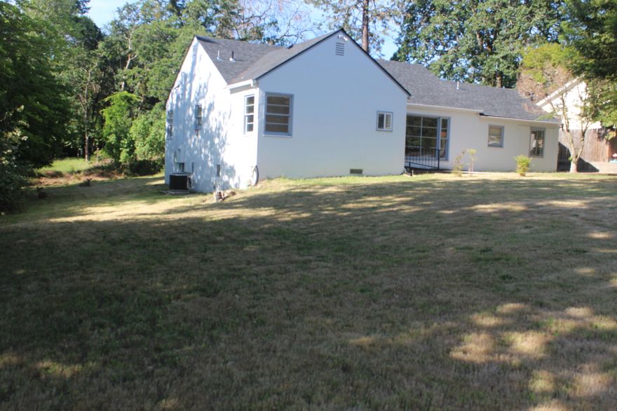 Outstanding location on large .29 acre lot.  This home has been tastefully remodeled with new kitchen cabs, counters, linoleum, carpet, and paint.  There is a bathroom and a half that both have been re-done as well.  New HVAC system will be a tremendous help.  Could be a fourth bedroom but there is not a closet, does have a door to the back yard.