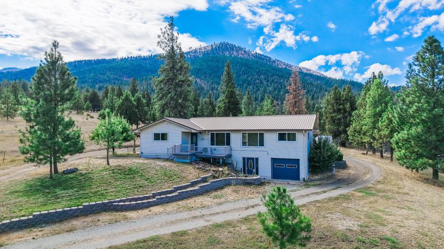 This stunning property spans 1.54 acres and features a wrap-around driveway. You can enjoy the serene experience of observing wildlife, such as deer and turkeys, right from your home.

Recently remodeled, this 2,669 sq ft residence boasts an open great room and fresh interior paint throughout. It includes vinyl plank flooring, new carpet, updated interior doors and hardware, and new vinyl windows. The kitchen and bathroom vanities have been newly poured, and there is recessed lighting along with modern light fixtures. The house is equipped with mini-split systems, oil furnace and wood insert.

Step outside to find a covered Trex deck in the back and an open Trex deck at the front of the house. Additional features include a one-car carport, multiple apple trees, a pear tree, and raspberry bushes. Seller is the listing agent & licensed in the state of Oregon.
Possible owner carry with large down.