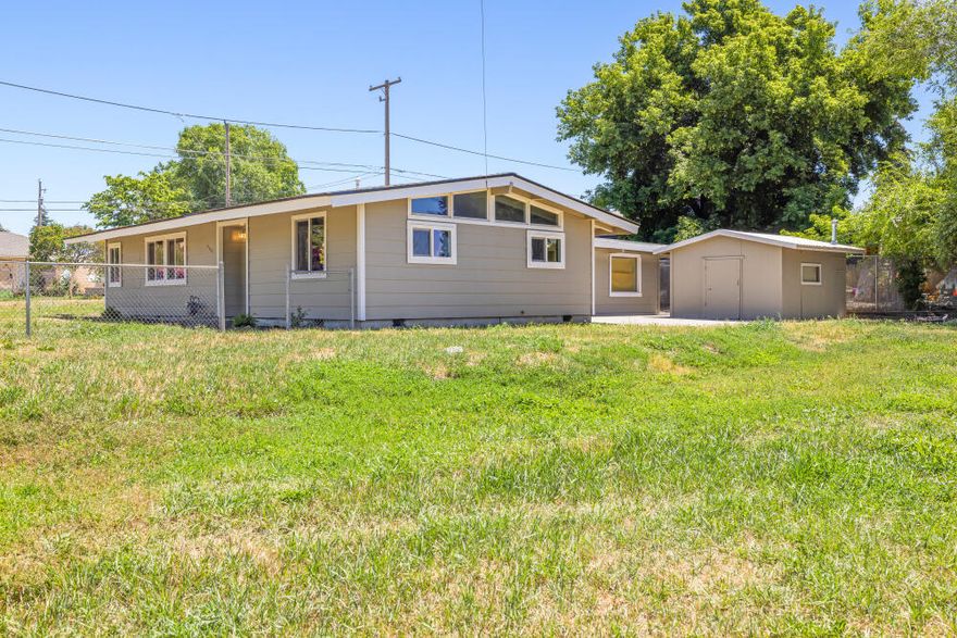 Home has recently been completely upgraded and remodeled.
Updated kitchen butcherblock eating area. Custom tile in kitchen and bathroom. Vaulted ceilings and natural light bring a warm feeling to the living space. 1 Year First American Home Warranty for new owners. Great suburban location close to schools. Extensive updates with open floor plan Lots of covered patio with concrete, a 12' X 14' shed for storage, 10' X 18' laundry/craft/hobby room, 20' X 20' carport and a large 20' X 40' driveway for parking. On a quarter acre with plenty of room for RV access and a separate storage shed and a side gate entry from Delaware. The back shed and patio area are all concrete and the property has a sturdy chain-link fence. This is a turn key home so come take a look. This lot may have enough space for an additional shop and or small dwelling unit.