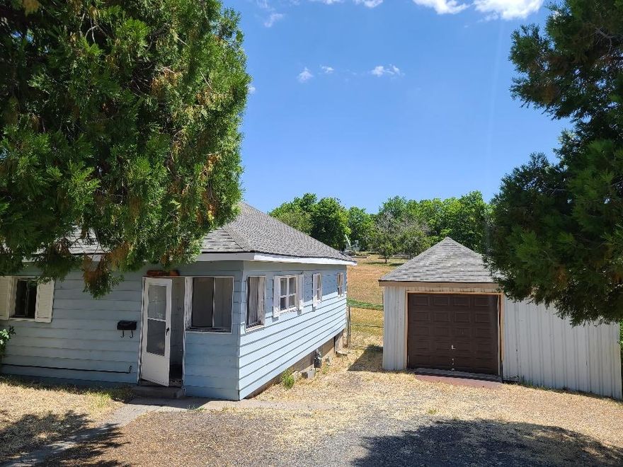 Cute little 2 bedroom one bathroom with some updates, it has with a separate laundry area and good sized kitchen and BIG backyard with a small deck. Nice little single car detached garage and plenty of parking.