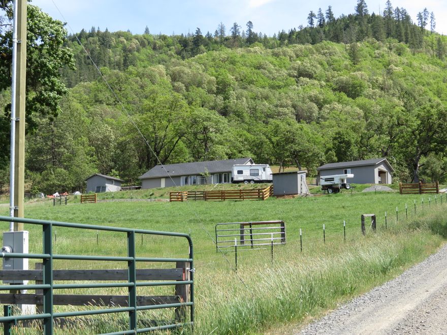 Newly built 2017 Home with great views of the  Mountains!! 4.89 Acres combined of two tax lots. The home has an open/split floor plan, vaulted ceilings and is 1556 sq ft. Large Master Bedroom w/nice size bathroom and walk-in closet. Laminate floors through out the home. 2 car detached garaged finished in 2021 and a small animal shelter with corral. This property is fenced and cross-fenced for all of your animals. The well has 40+/- gpm. RV Parking with septic dump. All driveway and RV area is graveled and pristine. Walk out the backdoor to the easy walking hillside to Acres of BLM land. Hike, Ride or just enjoy the animals that come down to visit. This is a beautiful home and property. Sale contingent on seller closing replacement property.