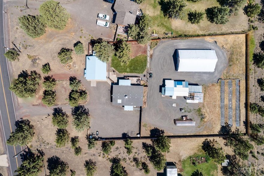 This newly remodeled home features a gated Driveway, new flooring, new master bath, fresh paint inside and out, open concept living, new windows, kitchen remodeled within the last 5 years & a 2 car detached garage. Located on a 1.03 acre lot with 6 a ft privacy fence, shed/shop with power, raised planters, multiple greenhouses including a 4 year old 30 x 50 greenhouse with automated light deprivation system and ventilation.