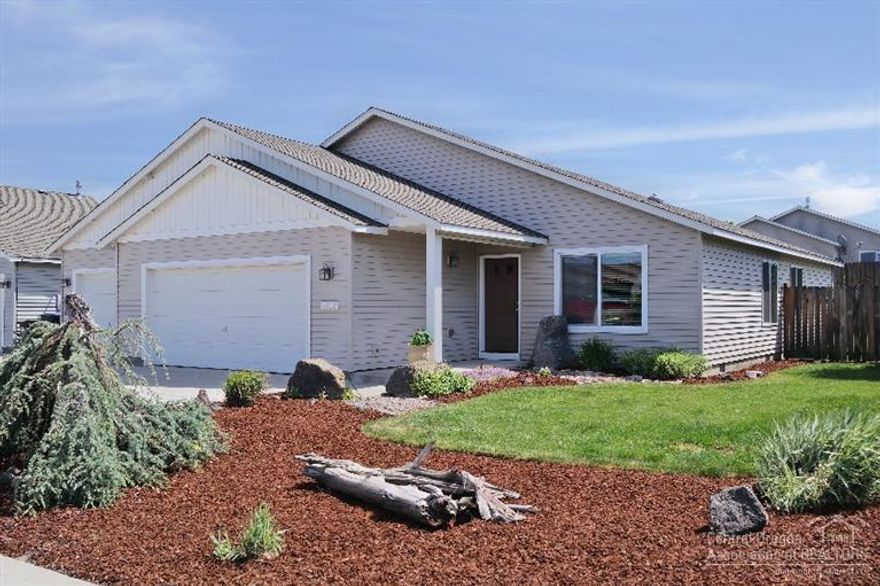 Come live in this inviting home on a spacious corner lot. Boasting neatly manicured front & back yard with underground sprinklers for both. Enjoy beautiful Cascade Mountain Views from your living room. Just across the street from middle & elementary schools, only a few miles away from medical offices and easy access to Hwy 97. Recently painted interior & shampooed carpets. This home is absolutely ready for a new owner, don't miss out.