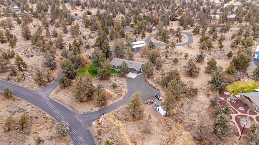 Welcome to this updated single-level home on 4.54 acres in peaceful Tetherow Crossing. The kitchen features quartz counters, white cabinetry, a farmhouse sink, a Boos butcher-block island from San Fran, & a skylight for added natural light. The fourth bedroom sites privately on the opposite side of the home. ideal for guests or a potential 2nd primary w/the addition of a bathroom. Interior highlights include solid wood doors & a cozy wood-burning stove. Outside enjoy a stamped-concrete deck w/hot tub, greenhouse,  & room to relax. The 1,902 sqft shop is wired w/ 220 power & 50-amp outlets-ideal for RVs, welder, or heavy equipment. Paved roads, nearby trails, and river access complete this exceptional property. (Seller offering $10K seller credit.)