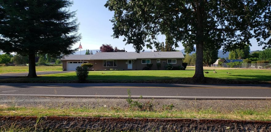 Great family home with room to roam on its 2 acres, plus the adjacent 2 acre parcel is available at this time. (Zoned RR-1!) The one level, 4 bedroom, 2 bath home sits towards the front of the parcel, so lends itself to all kinds of possibilities.