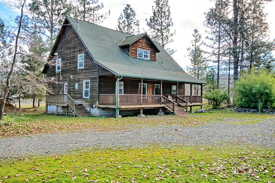 Modern Cedar Home on Nearly 5 Acres!
This 2240 sq.ft. cedar home blends charm, privacy, and potential. The level acreage offers fenced and cross-fenced gardens and pastures. Ideal for animals or hobby farming with multiple outbuildings including an equipment shed, storage/shop and a structure suited for small animals. Enjoy the peaceful country setting from the covered porch or yard with firepit. Inside, the open living area features vaulted ceilings and abundant natural light. The main level includes a spacious primary suite with walk-in closet and jetted tub, plus a guest room and full bath. Upstairs offers another bedroom, full bath, large storage closet, and an almost finished bonus room above the laundry perfect for an office or craft space. Trees around the home provide shade and enhance the sense of privacy. This home is ready for some TLC and a fresh beginning.