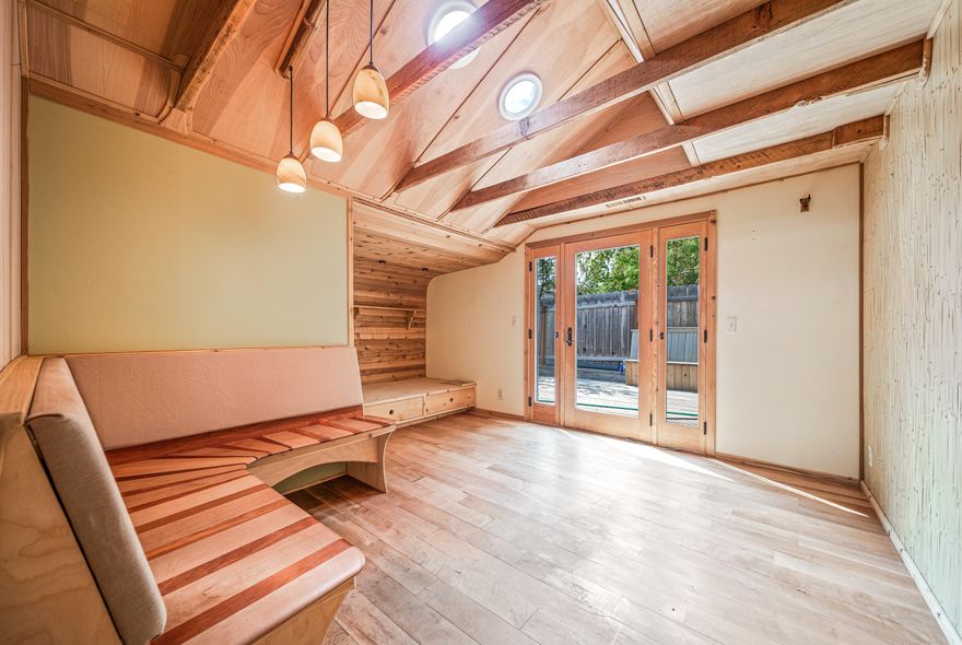 Adorable 1 BD/1 BTH home just blocks from downtown Ashland with RV parking! This cottage-style house sits at 1020 sqft and has potential of being a 2 BD by adding a closet and door! Remodeled in 2008 with beautiful, custom woodwork including madrone, palm, cedar and bamboo throughout! The spacious kitchen has stainless steel appliances and unique kiri board countertops. The living room offers plenty of space with a built-in desk, additional built-in shelving/storage space, and a big window facing the adorable front garden. Primary bedroom has madrone flooring and beautifully crafted vaulted ceilings with a skylight. The bonus room also has madrone flooring, vaulted ceilings, solar tubes and built-in lounge/dining area. The bathroom has marmoleum flooring, kirei board vanity and a beautiful copper sink! This property also includes a laundry room, large patio, cedar deck and outdoor covered seating area, perfect for entertaining! Don't miss the chance to view this property today!