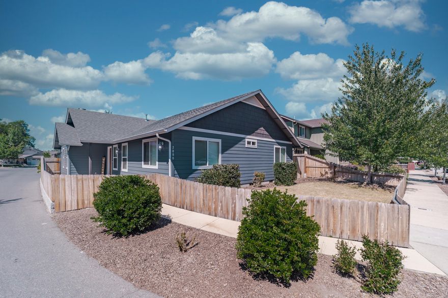 Corner Lot home located in the Candlelight Park subdivision. This 2014, 1468 sq ft built home is 3 bedrooms, 2 bathrooms and is turnkey. The entry opens up to a large living room with vaulted ceilings, laminate flooring, plant shelving and an open concept design. The upgraded kitchen has black slab granite counters, hardwood cabinets, a breakfast bar, stainless steel appliances and pantry for extra storage. You will love the split floor plan. The Primary suite is oversized with vaulted ceilings and a walk in closet. The primary bathroom has granite countertops, double sinks, hardwood cabinets, and walk in shower. The other side of the home is where 2 more bedrooms and a full bathroom are located. Attached 2 car garage with alley access to the back of the home. Backyard patio with plumbed gas for your BBQ.