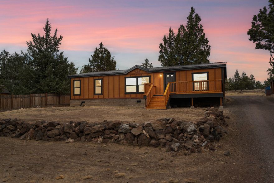 BRAND NEW FULL RENOVATION! Step into this beautiful turn-key home to find it is as good as new. Interior renovations include: luxury vinyl plank, carpet, doors, paint, and more! Kitchen features hickory cabinets, brand new SS appliances, gorgeous butcher block countertops and tile backsplash. Primary bedroom stuns with tall ceilings, tiled step-in shower, double vanity with marble top and HUGE closet. Guest bedrooms ready for family or home office. Tiled tub surround in hall bathroom. Brand new heat pump and furnace, 1 year old. House has all-new cedar siding, metal roof, new windows, and new exterior doors. Expansive front deck for mountain viewing, covered back porch leads to a shady area ready for landscaping. XL garage also has new siding and new roof, 2 car + extra workspace! Property is fully fenced and backs to CRR owned property. You won't want to miss this deal!