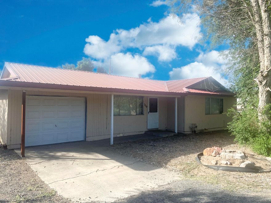 Two bedroom, two bath, gas cook stove and fireplace,  large fenced back yard with two storage sheds. Large gate on the north side of house to enter the back yard.