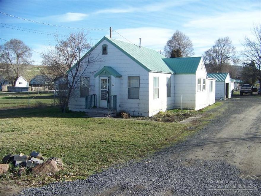 Very special property with lots of income potential and in a great area of new growth. Units consist of a nice home with a detached garage and storage. Behind the home is the manufactured home that could be used as a rental also. Located at the East end of the property is a Tri-Plex. Units have long term tenants one tenant has been there since 1992. Perfect location for future growth commercially.