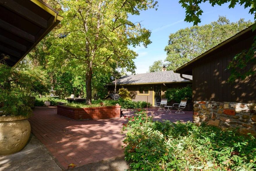 One of a Kind property with a large home and guest house. Drive 3 minutes and you are at the Del Rio Winery for wine tasting or strolling along the mighty and scenic Rogue River! Location, Location, Location this is a rare opportunity to find a property like this, so close to Medford and Grants Pass! 3 wells, 1 barn, 4 car garage/shop (with 220 & compressed air), huge carport with enclosed rooms for storage, shooting shack & range and the list goes on! As you drive up through the beautiful mature trees and scenic pastures you will see a lovely pond with a streaming fountain inviting you into the courtyard of this estate home. The land backs up to BLM , take in amazing views!. The land also has a natural spring. Main dwelling is 3 bedroom, 2 bath, 2751 sqft.