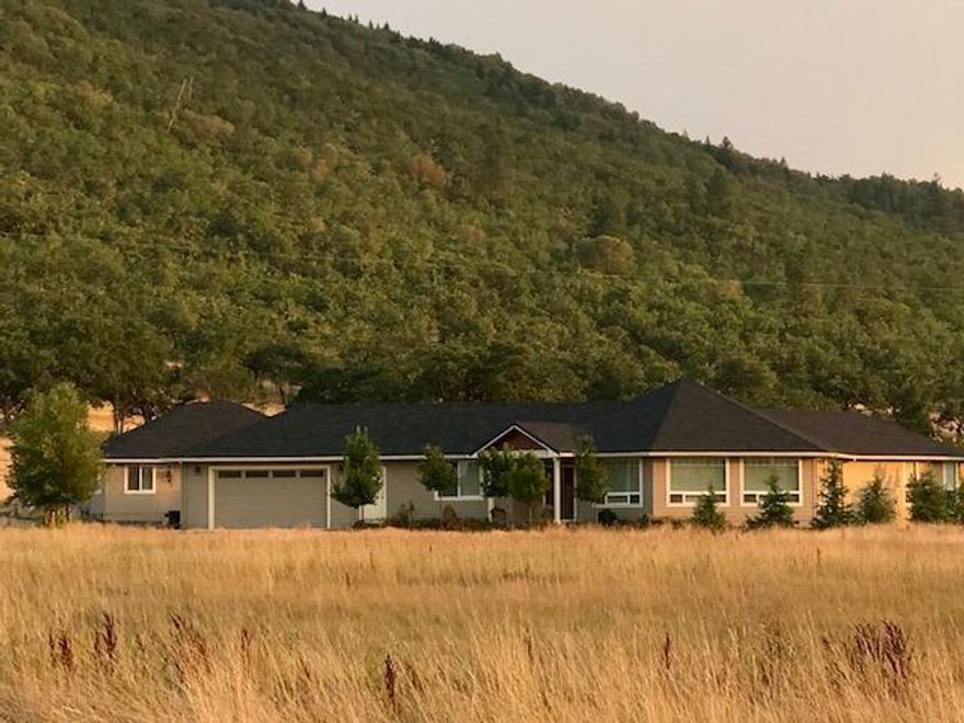 One of a kind single level Custom home on 9.6 acres is a must tour! Built in 2014 this 2400 plus sq ft gem is in excellent condition and shows like new. Well designed split level plan is spacious, comfortable, and offers lots of upgraded amenities throughout. Enjoy the wrap around bay windows for tons of natural light and great mountain view's. Beautiful kitchen boasts a center island, granite counter tops, walk in pantry, and all SS appliances. Impressive master suite with large bathroom features double sinks and a nice custom surround shower. Out back discover a 768 sq ft detached finished garage with full bath makes for an outstanding In-law quarters or guest house potential. Truly a pleasure to show property so be sure to schedule a showing today.