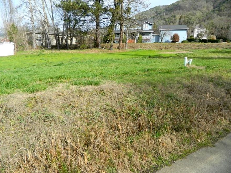 Hard to find View building lot in NE Grants Pass. Utilities in the street. Shared driveway with maintenance agreement. There is an open Irrigation ditch on property. There are 2 trees the city has identified that can not be cut down without permission from the city. Buyer to reimburse seller $30,222.59 which seller paid to city of Grants Pass for the future Street Improvement per Deferred Development Agreement. See attached map and agreement. Buyer to do their own due diligence.Deed restriction for Height of building.