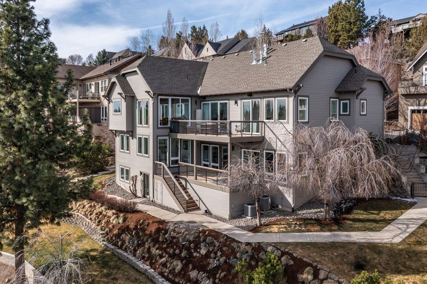 Perched above a breath-taking stretch of the Deschutes River lies a rare gem!
Location pairs perfectly with the home as they are both STUNNING!  Natures beauty is brought in through floor to ceiling windows, offering panoramic views of towering Ponderosa pines, distinctive lava formations and the tranquil river. The home greets you with a warm embrace the second you set foot inside. COMPLETELY renovated in 2021 with high-end finishings: white oak floors, extensive custom cabinetry, Heath and Fireclay tile, designer lighting, and more!
Style AND function blend harmoniously with; 2 Master bedrooms/baths, 2 additional bedrooms with en-suite bathrooms, 2 inviting living rooms, chef's kitchen, office/gym, two car garage, gear garage, 2 IPE decks, hot tub, beautiful 2nd office with separate entrance (not counted in sq ft) AND a private river trail. All within a 5 minute walk to First Street Rapids and 12 minute walk to Downtown Bend!