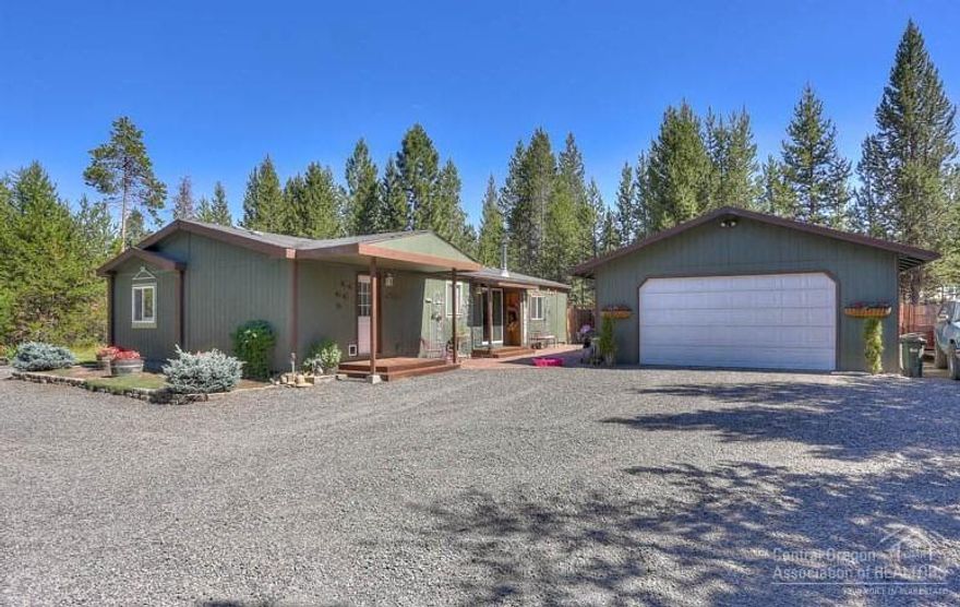 Well Maintained 4Bd Home+ 760sf Shop/Garage! 1998 single level home with block foundation features: vaulted great room with tiled entry & wood stove/stone hearth, dining/kitchen with wood-lam flooring, island/Breakfast Bar, large master suite with private bath & tiled floor, laundry/mud room, large extra deep insulated garage/shop with cement slab floor & power, RV access/parking, landscaped with in ground irrigation/sprinkler system, patio, electric forced air heating and all on a large 1.06 acre lot!