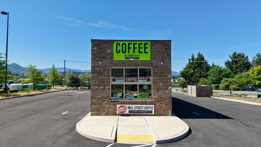 Don't miss this prime business opportunity in the heart of Grants Pass! Turnkey coffee stand business, equipment, building and land for sale in a premier high-traffic location next to Home Depot. This 857-sq. ft. building, completed in 2023, features dual drive-thru windows, a restroom, office and space for food prep. Plumbed for natural gas with 400-amp electrical service. Excellent ingress/egress with no center median allows for easy customer access from both directions. Ample employee and overflow parking. Located in the heart of a growing commercial district, this property offers unmatched visibility and accessibility. A rare chance to own a high-profile site with proven traffic and strong growth potential. Back on market at no fault of the property.