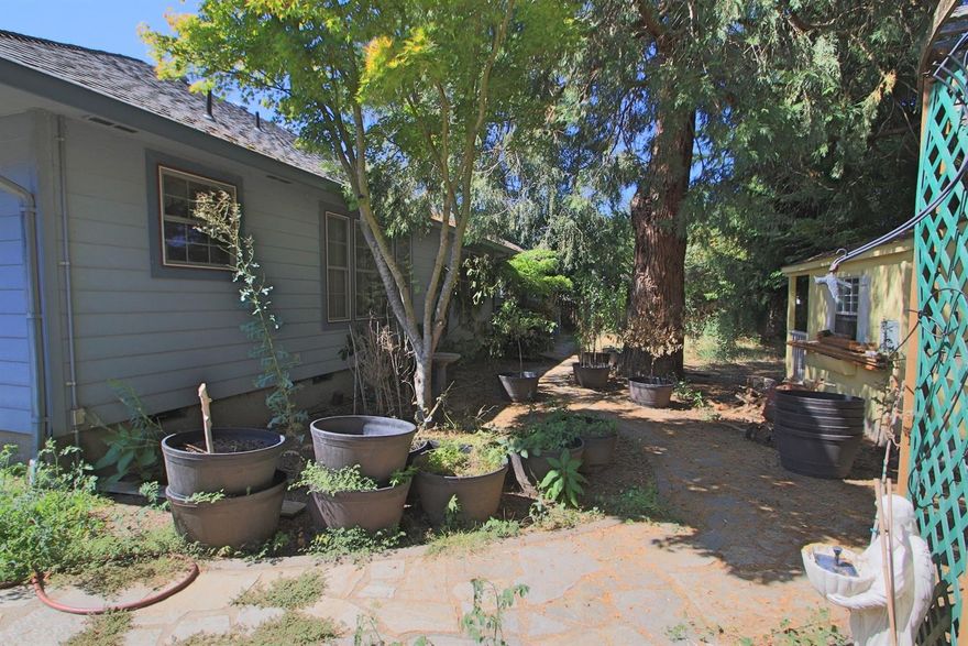 Dimond in the Rough! Yes, the landscaping needs some love but the home is spacious, loads of storage space, wood laminate flooring, and a great master suite with walk-in closet and more! Handicap accessible features throughout the home, gas fireplace, built ins, and a great location on a nearly-quarter-acre lot. Great value in a prime location with neighborhood access to the Rogue River.