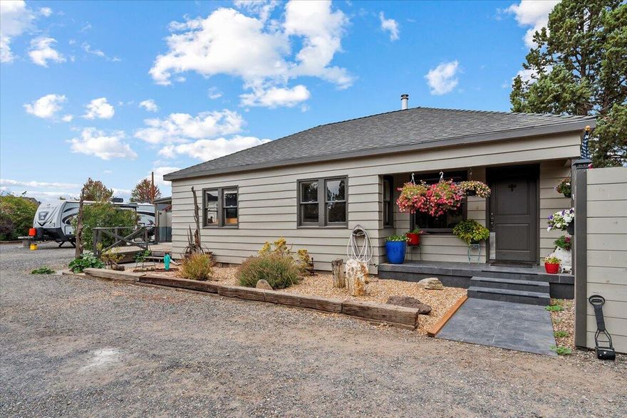 Charming cottage with updates on a spacious 0.36-acre lot in a desirable NW Redmond location! This 2-bedroom, 1-bath home offers 1,179 square feet of comfortable living with thoughtful updates throughout. Outside, you'll find a detached garage/shop, covered RV or vehicle storage, and full fencing with gated access-ideal for privacy, pets, or projects. According to the Seller, the property may also offer development potential for a multi-family unit or other infill opportunity (buyer to do due diligence). Whether you're looking for a cozy place to call home or an investment opportunity, this versatile property is full of possibilities!