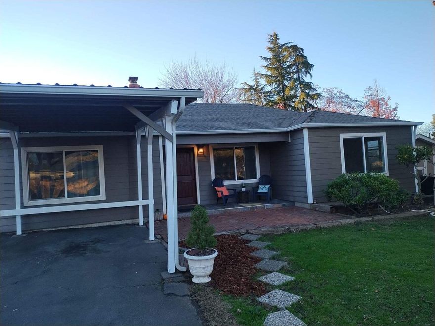 Here it is, lovely single level upgraded, updated home in desirable East Medford neighborhood! You are literally minutes from all the best amenities in Southern Oregon!! Head N for dining, retail, gym and the mountain lakes of the Pacific NW! South you're headed to the stunning Rogue Valley Country Club for some recreation or Roxy Ann winery for a lovely glass of SO's finest, try taking the back country road to Ashland for some Shakespeare! Just minutes from indoor Pickleball! You'll love to enjoy your morning coffee on your covered porch while taking in the sunrise over Roxy Ann mountain! The floor plan for this 4 bd even includes a bonus room! Granite throughout, cozy real fireplace for warm days of reading fireside! Backyard has two wonderful storage outbuildings.  Lovely setting for backyard bbq's, lots of room for parking and turn around, plenty of room for a garage or workshop!  Truly lovely home in a lovely location!! Charming and cozy with lots of beautiful alcoves and arches!