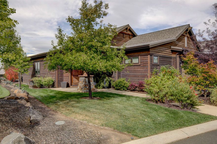 Sophisticated elegance abounds in stunning mountain view Single Level Tetherow townhome. Upon entering, you will be enveloped by a sense of tranquility inspired by clean lines, vaulted ceilings and beams of sunshine streaming in the windows. The finest appointments enhance the open floorplan; perfect for entertaining inside & out, or for curling up and relaxing by the fire & enjoying  sunset views over the Cascades.
Fabulous kitchen inc. custom cabinetry, prep island, a secondary island w/ bar seating and a wet bar w/ wine fridge and glass enclosed shelving. Decadent primary suite offers amazing westerly views and a calming sense of space created by the soaring ceilings, ceiling fan, wood flooring and a zen-like bath w/ individual vanities and a custom closet of your dreams w/access to spacious laundry. There is also a luxurious full-ensuite guest bedroom and separate den/office that could easily transform into an addtl bedroom. 2-car garage & rare full attic providing abundant storage