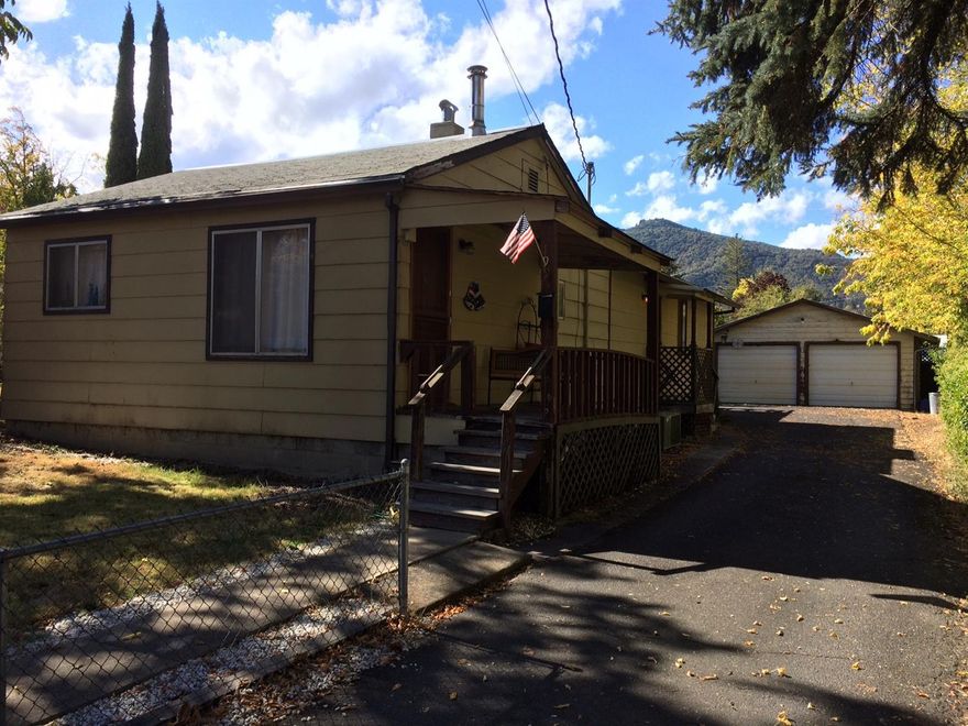 Diamond in the rough! Ashland single level cottage built in 1949 and expanded in 1985 on R-3 lot with detached 2 car garage and large adjoining workshop or artist studio behind garage. This property is being sold as-is condition. Current zoning allows for a second home to be built on the property. Two bedrooms, two full baths, family room and large utility room. Newer hot water heater and brand new forced air furnace. Comfortable covered cement patio in backyard. This property is located near the high school and downtown Ashland. Excellent investment opportunity!