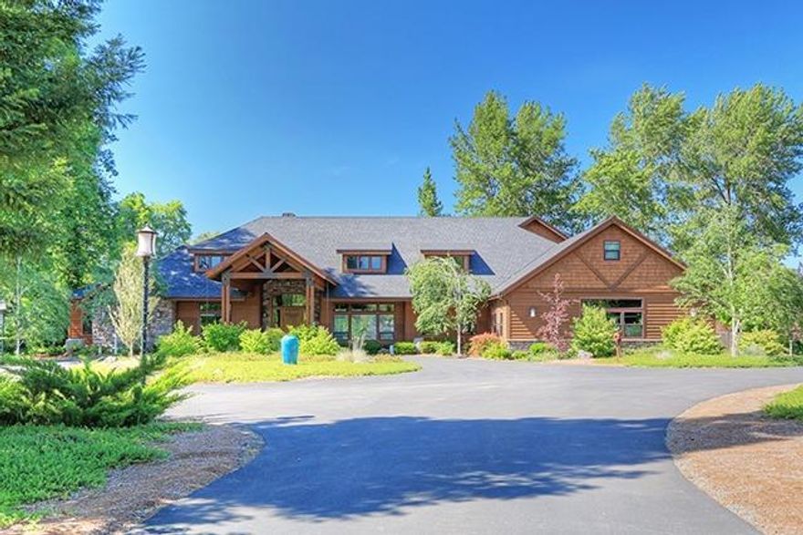 This outstanding custom NW styled home was meticulously built in 2009 by Tom Tobey Design & Build Inc. Overlooks the mighty Rogue River on the Eisman Stillwater with over 425' of low bank frontage and flanked by Sparrow Hawk Creek. The home features 4 bedrooms, 3.5 baths, approx. 5490 sf., 4.48 acres, walnut hardwood floors, formal dining room, great room with vaulted ceilings, Extraordinaire fireplace, gourmet kitchen with large island, Wolf 6 burner dual oven and griddle, sub zero refrigerator, custom hood, 2 walnut butcher blocks, custom wet bar with climate controlled wine storage, office with built in desks, master bedroom has 2 walk ins. Private boat ramp, 30KW generator, dock, green house, porte cochere, barn/shop with bath and finished 2nd story, 2nd shop, solar system, security gate, raised beds. All information is deemed reliable but not verified; anyone considering purchasing this property should perform their own investigation into the uses and condition of the property.
