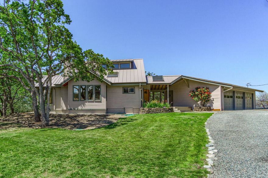 Exquisite, updated home + Studio on over 10 acres. Serene setting w/gorgeous views of rolling hills & mountains. Minutes to the best wineries, Emigrant Lake & downtown Ashland w/top restaurants in S. Oregon. Extensive remodel with over $300,000 invested into the best finishes, and metal roof. Open floor plan w/open beams ceilings & main level master suite w/lg walk-in closet & built-ins. Master bath is updated with a tile shower & soaking tub w/views. Elegant chefs kitchen with large butcher block island, high-end stainless steel appliances, quartz counters, and designer cabinet lighting. Home is energy efficient with an exceptional Tulikivi, soapstone radiant fireplace w/ elec option, pizza oven, and ductless mini split systems throughout. Finishes include hardwood oak floors, High-end fiber optic Hunter internet, new interior paint, large windows and sliders to take in views, separate finished studio w/ ductless hvac, and designer touches throughout.