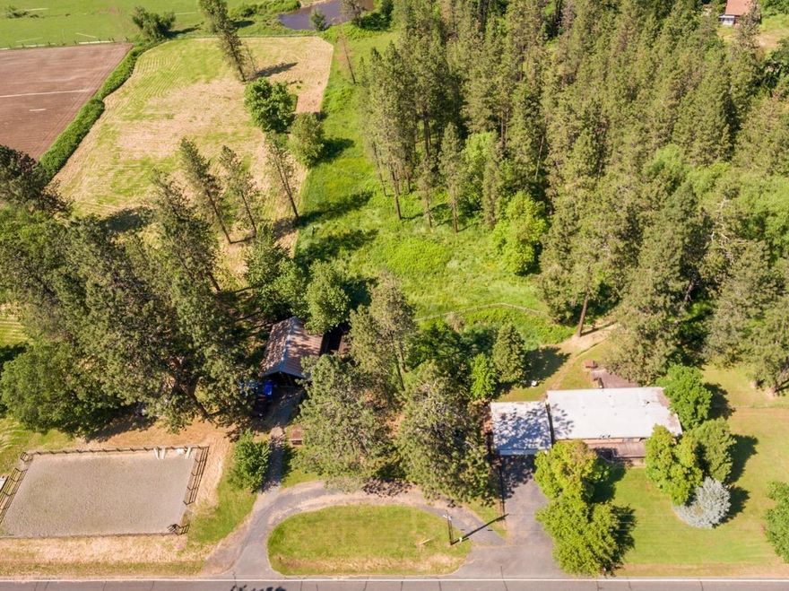 Beautiful Williams property with fantastic end-of-road privacy in a peaceful country setting! Great rural home nestled on 9.51 gorgeous acres of level, usable land- fully fenced, cross-fenced, and with multiple pastures! The 3 bed 2 bath home could use a little TLC- It offers a welcoming floor plan & two separate living spaces. This property also boasts an array of outbuildings: oversized two car garage/shop, equipment shed, barn, garden shed, and chicken coop. Looking for an affordable horse property? Great, there is even an established 100' x 40' riding arena! This amazing property also features RV parking w/ hookups and a small spring-fed pond! This one-of-a-kind property has amazing potential for anything you have in mind w/ breathtaking mountain views & excellent sun exposure it's ready for your personal dream!